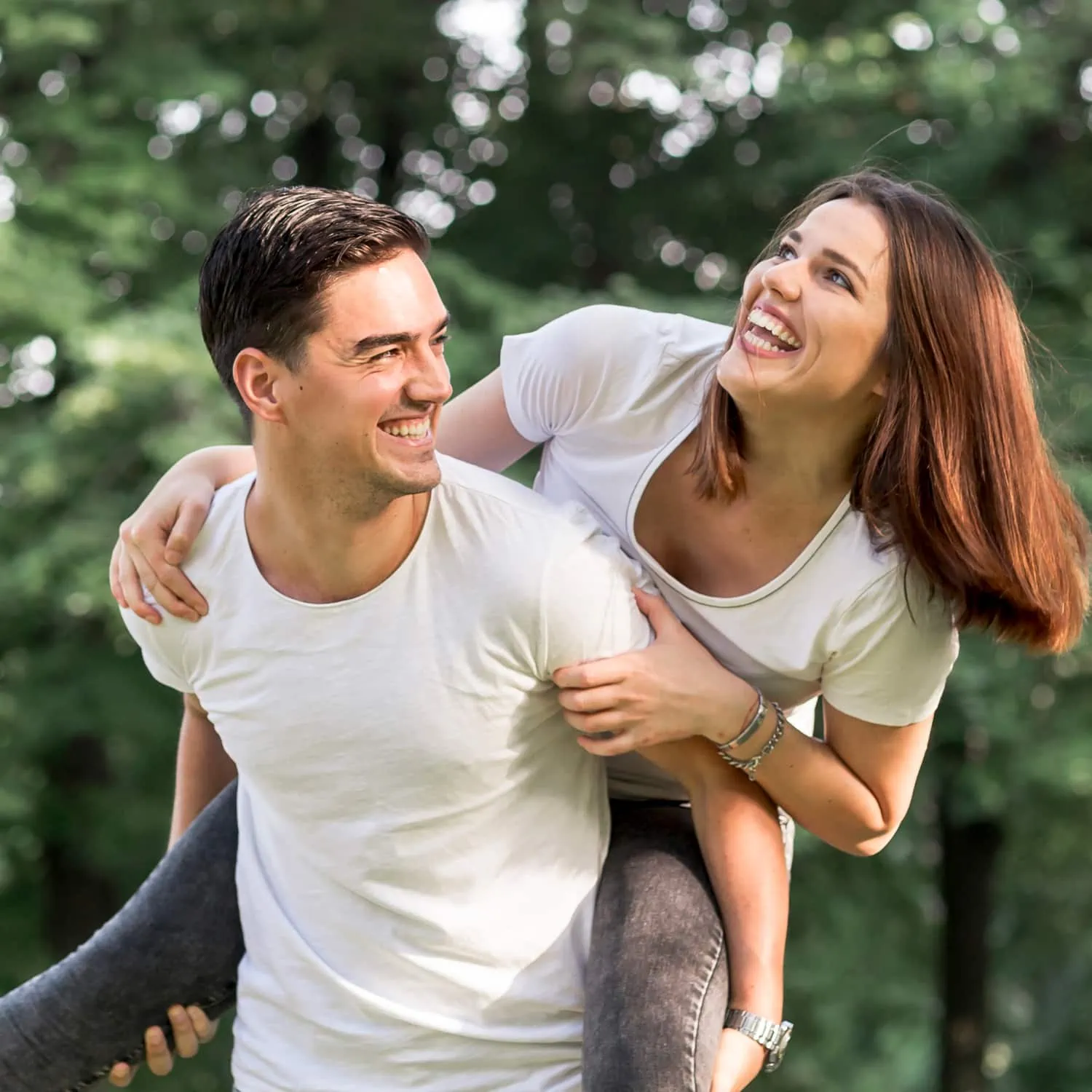 close-up-young-man-carrying-his-smiley-girlfriend