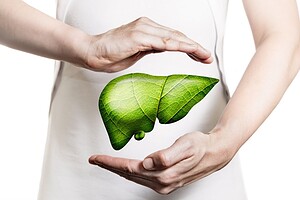 Hands protecting a floating green leaf-textured liver.